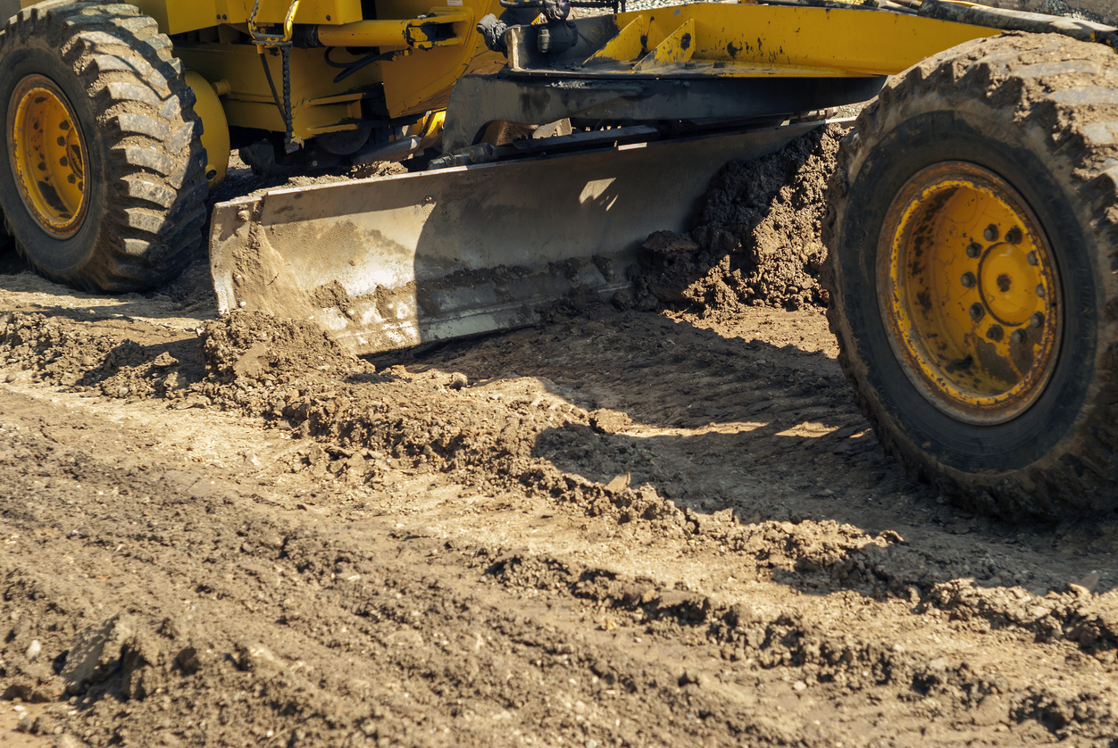 picture of tractor pushing mud