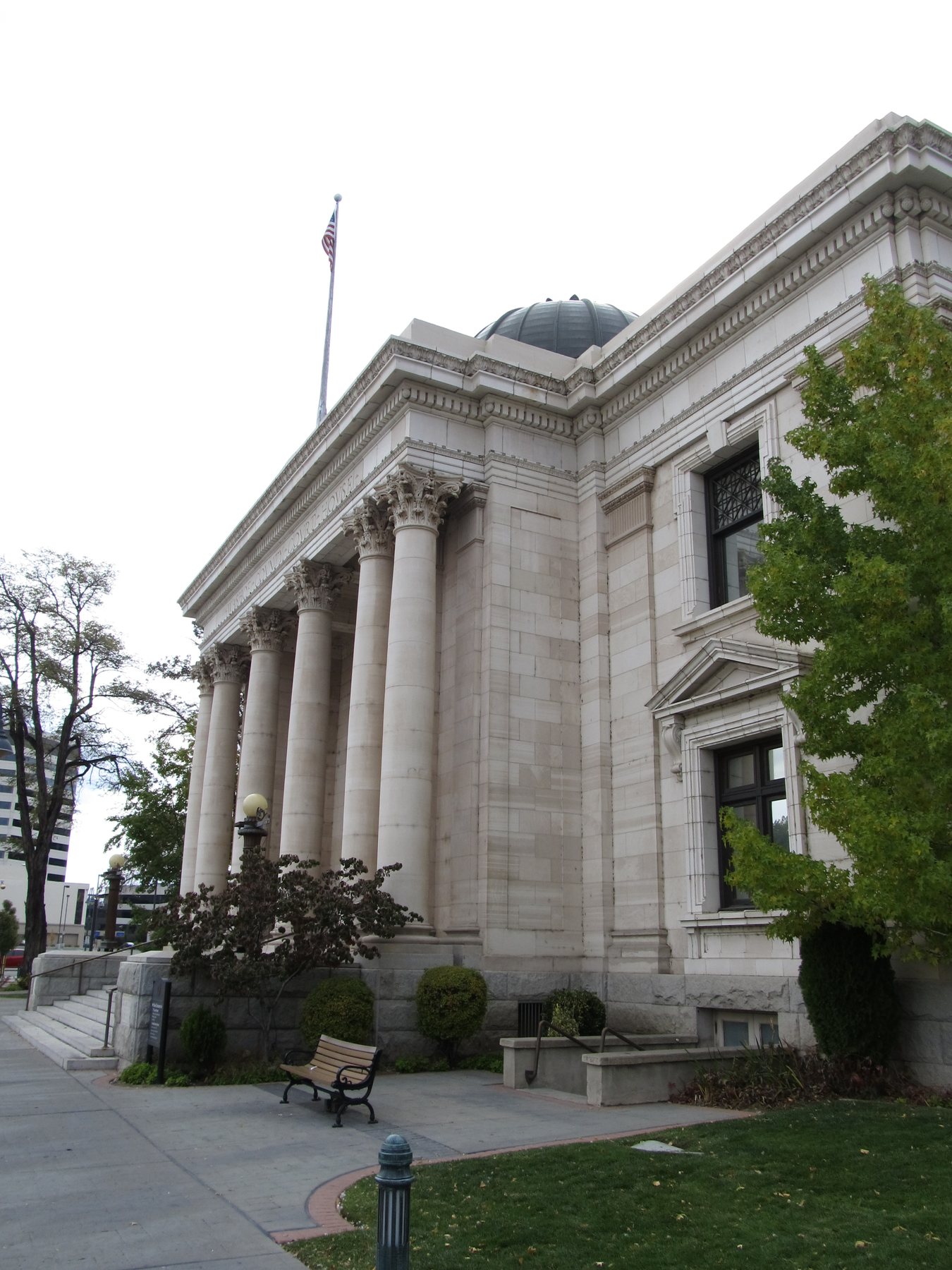 Close view of the Washoe County Courthouse façade with arched windows and stone details.