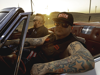 The band Moonshine Bandits sitting in a car