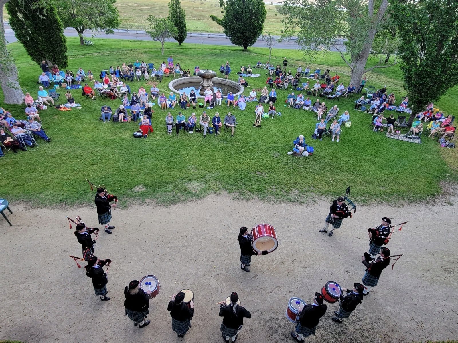 Scottish Pipers performing in front of Bowers Mansion