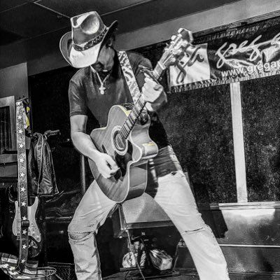 Photo of musician playing guitar