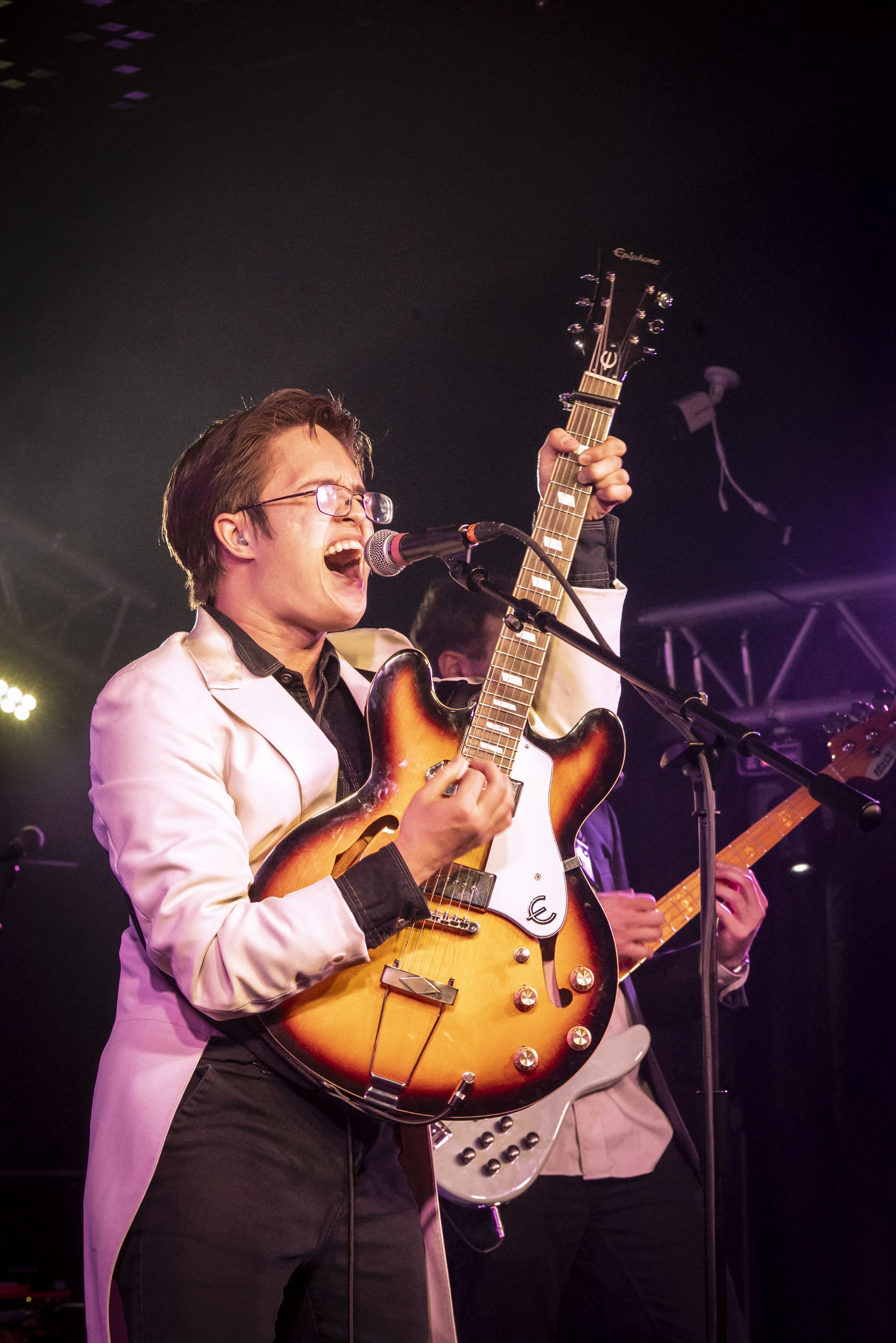 Photo of Michael Tegio playing guitar
